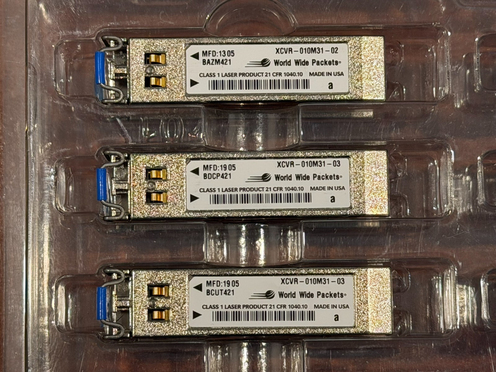 Lot of 47 World Wide Packets XCVR-010M32 Optical Transceivers – Used