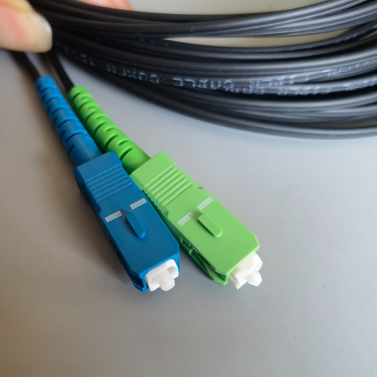 10M-50M Indoor Fiber Optic Drop Cable Single-Core Black SC/APC To SC/UPC